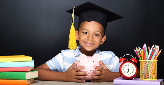 Young,African,American,School,Boy,Sitting,At,Desk,With,Books,